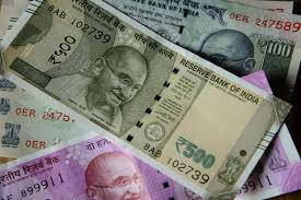 Rupee closes higher